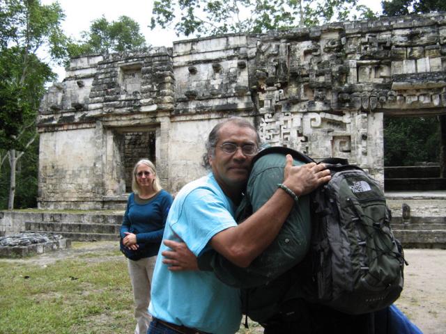 Miguel Angel Vergara and Richard Jelusich embrace after the Ritual of the Sacred Wine, the Balche ceremony at Chicanná.